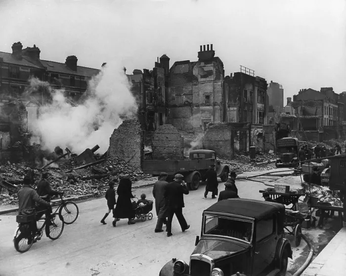 Framed Print : World War 2, Battle of Britain. Londoners walk through a ruined street with their bicycles and a baby carriage during the Blitz. Ca. 1940-41. (BSLOC_2013_11_91)