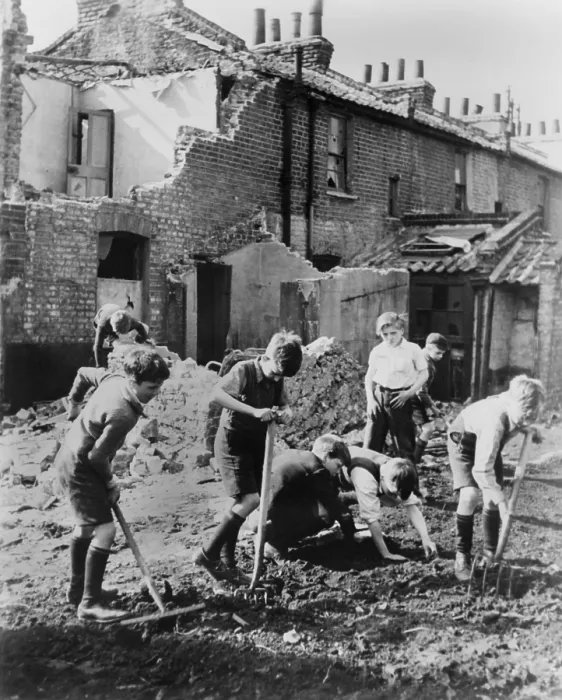 Framed Print : World War 2, Battle of Britain. Young boys with pitchforks and rakes start a garden next to buildings damaged by air raids. Between 1940-1945. (BSLOC_2013_11_92) Framed Print : World War 2, Battle of Britain. Young boys with pitchforks and rakes start a garden next to buildings damaged by air raids. Between 1940-1945. (BSLOC_2013_11_92)
