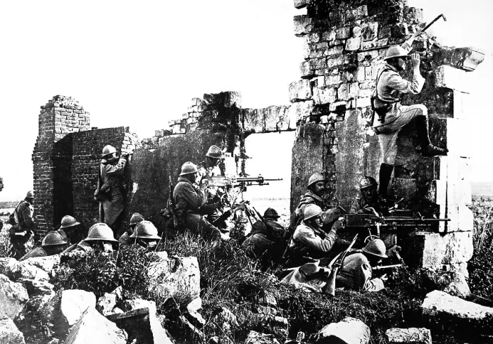Framed Print : World War I French troopers under General Gouraud, driving back the Germans with their machine guns, from the shelter of cathedral ruins. 1918