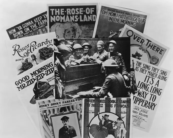 Framed Print : World War I soldiers gathered around a piano, framed by war song sheet music covers. Over There, It's a Long, Long way to Tipperary, are shown. 1917-18 Framed Print : World War I soldiers gathered around a piano, framed by war song sheet music covers. Over There, It's a Long, Long way to Tipperary, are shown. 1917-18