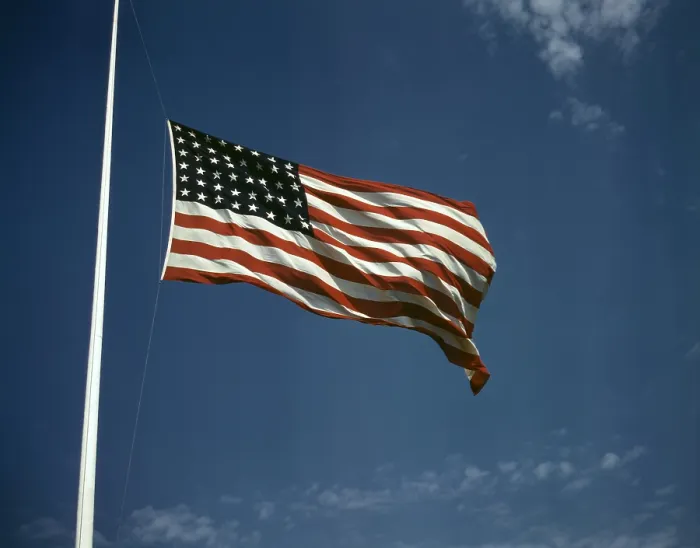 Framed Print : World War II, American flag, original caption: High above Framed Print : World War II, American flag, original caption: High above