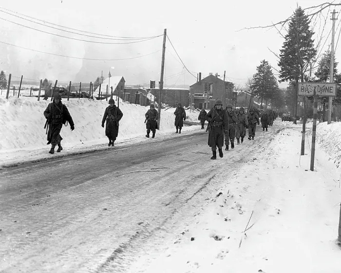 Framed Print : World War II. US Army infantrymen march on a road near Bastogne, Belgium. Dec 1944 Framed Print : World War II. US Army infantrymen march on a road near Bastogne, Belgium. Dec 1944
