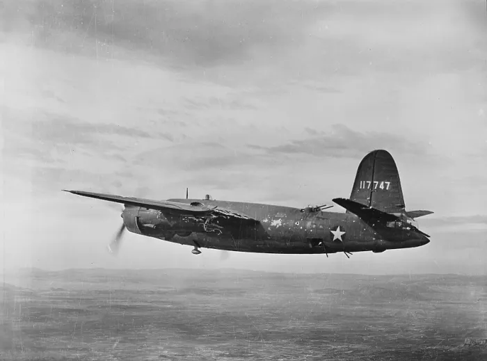 Framed Print : World War II, B-26 Martin Marauder, riddled with bullets in the engine and left wing making a successful trip back after a bombing raid in Tunisia, circa 1943