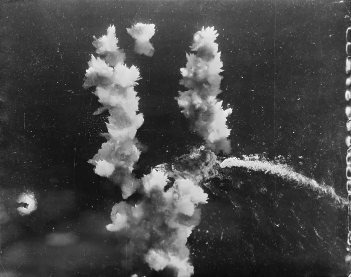 Framed Print : World War II, a direct hit on a 400-foot Italian liner converted into a troop carrier. The hit was made by a Flying Fortress in the Mediterranean Sea, circa 1943 Framed Print : World War II, a direct hit on a 400-foot Italian liner converted into a troop carrier. The hit was made by a Flying Fortress in the Mediterranean Sea, circa 1943