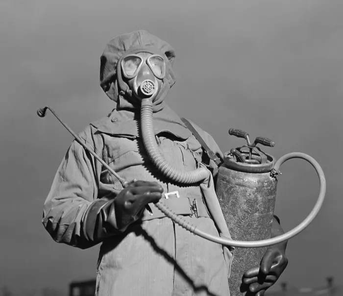 Framed Print : World War II era American soldier in a decontamination suit. December 1942