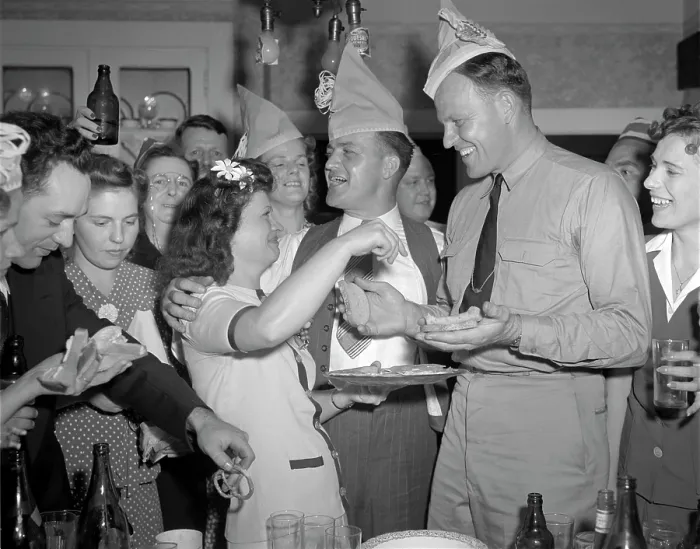 Framed Print : World War II, George Woolslayer (center), soldier and sailor with a party at his home, friends, relatives and fellow workers made up the list of guests, Mrs