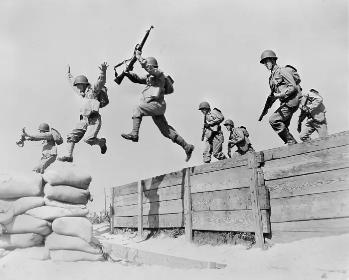 Framed Print : World War II, original caption: A hard-running leap takes these artillerymen over one of the obstacles on the course at the anti-aircraft training center Framed Print : World War II, original caption: A hard-running leap takes these artillerymen over one of the obstacles on the course at the anti-aircraft training center