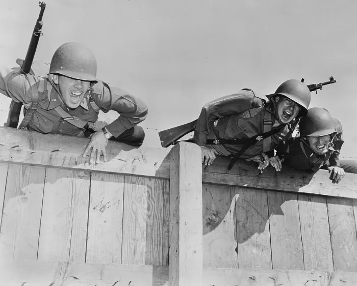 Framed Print : World War II, original caption: Officers are shown completing the final obstacles of a tough course, topping the six-foot wall, the last part of the under-and-over obstacles Framed Print : World War II, original caption: Officers are shown completing the final obstacles of a tough course, topping the six-foot wall, the last part of the under-and-over obstacles