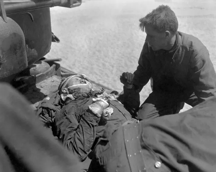Framed Print : Wounded, but alert, U.S. soldier in an outboard stretcher-basket attached to rescue helicopter Framed Print : Wounded, but alert, U.S. soldier in an outboard stretcher-basket attached to rescue helicopter