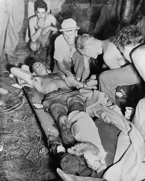 Framed Print : A wounded American soldier gets a blood transfusion in New Guinea jungle. The U.S. Army was fighting against the Japanese during World War 2. 1943-45. (BSLOC_2013-12_182) Framed Print : A wounded American soldier gets a blood transfusion in New Guinea jungle. The U.S. Army was fighting against the Japanese during World War 2. 1943-45. (BSLOC_2013-12_182)
