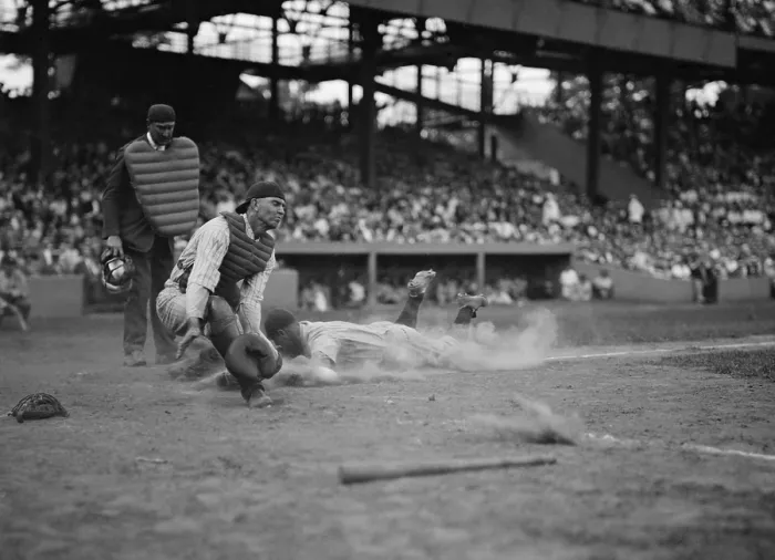 Framed Print : Yankees Lou Gehrig scores as Joe Harris throw gets away from catcher Hank Severeid of Senators. New York Yankees beat Washington, Senators 3-2. Aug. 16, 1925