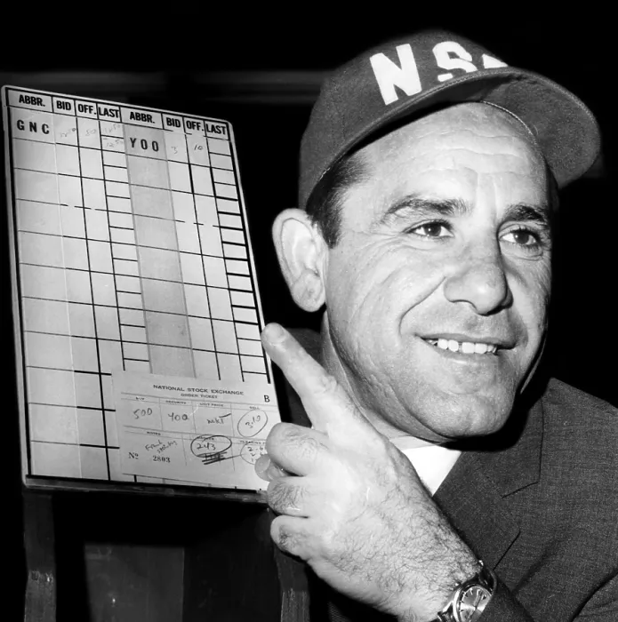 Framed Print : Yogi Berra holds up a sign with the National Stock Exchange numbers for his Yoo Hoo Beverage Corporation, 1967. Courtesy: CSU Archives / Everett Collection Framed Print : Yogi Berra holds up a sign with the National Stock Exchange numbers for his Yoo Hoo Beverage Corporation, 1967. Courtesy: CSU Archives / Everett Collection