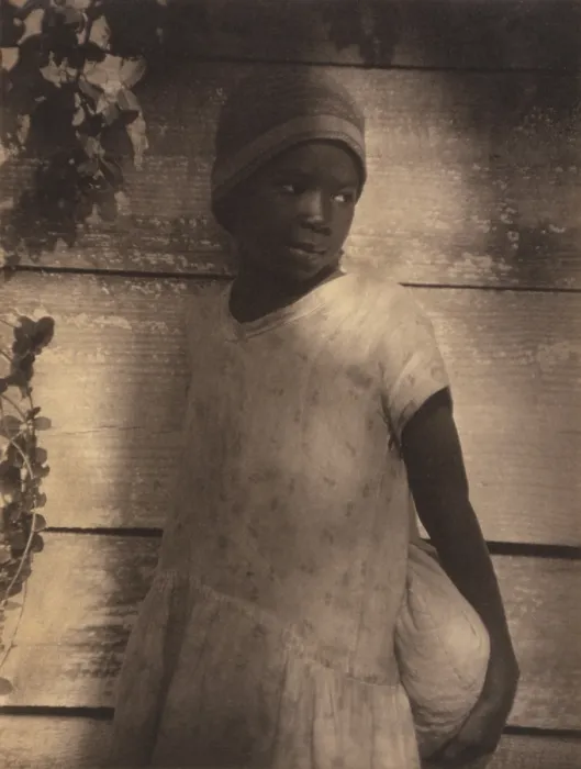 Framed Print : Young African American girl holding bag in sensitive portrait by Doris Ullman, ca. 1930. Ulmann graduated from the Clarence H. White School of Modern Photography
