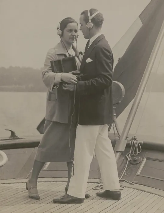 Framed Print : A young couple equipped with a portable radio outfit dancing to a broadcasted fox trot