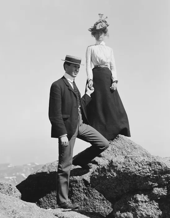 Framed Print : Young couple holding hands while posed on mountain rocks, c. 1900-1910 (BSLOC_2018_3_82)