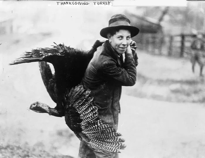 Framed Print : Young man with Thanksgiving turkey, circa 1910s Framed Print : Young man with Thanksgiving turkey, circa 1910s