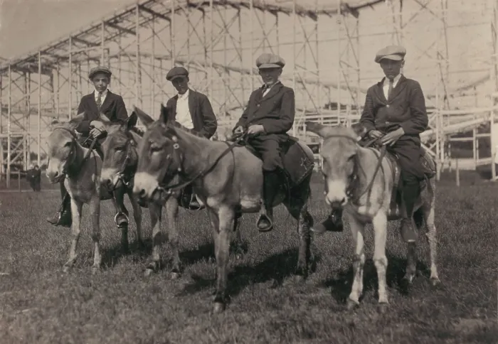 Framed Print : Young men on donkeys, original caption: Sandy Beach, Sunday recreation - mill boys 14-16, Fall River, Massachusetts, photograph by Lewis Wickes Hine, June, 1916