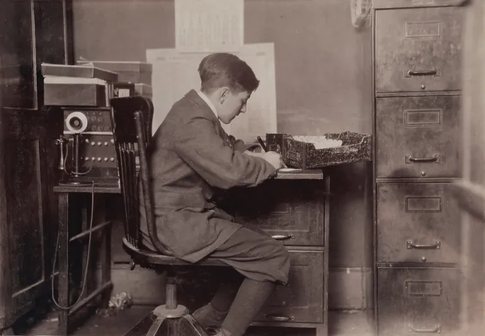 Framed Print : Young office boy, working for J.J. O'Brien and Sons on East 23 Street, over 16 years old, New York City, photograph by Lewis Wickes Hine, January, 1917 Framed Print : Young office boy, working for J.J. O'Brien and Sons on East 23 Street, over 16 years old, New York City, photograph by Lewis Wickes Hine, January, 1917