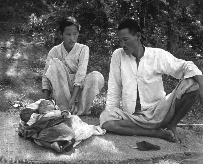 Framed Print : A young refugee family living in a refugee camp at Changseung-po, Korea. October, 1950. Korean War, 1950-53. (BSLOC_2014_11_241)