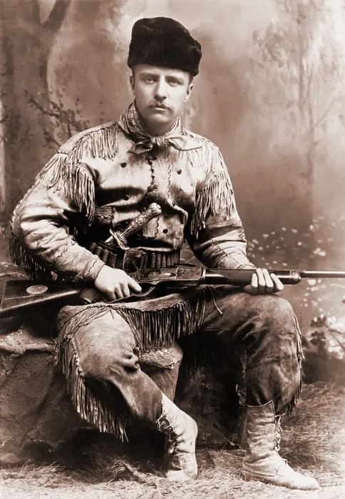 Framed Print : Young Theodore Roosevelt dressed in deer skins, posing with a rifle in an 1885 studio portrait Framed Print : Young Theodore Roosevelt dressed in deer skins, posing with a rifle in an 1885 studio portrait