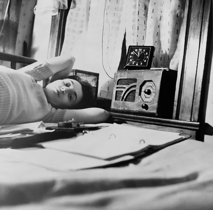 Framed Print : A young women listens to a radio in her Washington D.C. boardinghouse room. 1943 Framed Print : A young women listens to a radio in her Washington D.C. boardinghouse room. 1943