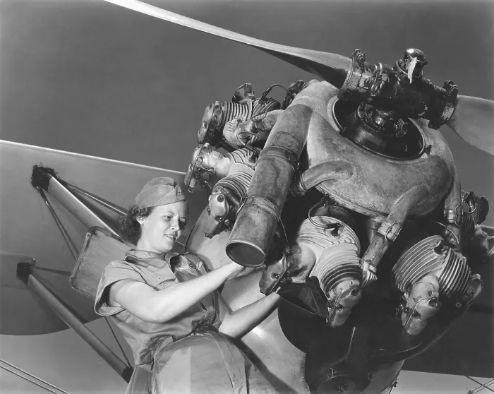 Framed Print : A young women soldier of Women's Army Corps (WAC) repairing aircraft during World War II. Ca. 1943-45. World War 2. (BSLOC_2013_14_109)