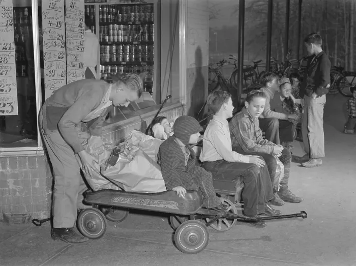 Framed Print : Youngsters hiring out their express wagons to haul groceries in suburban Greenbelt, Maryland. World War 2 tire and gasoline rationing created this business opportunity. Nov. 1942