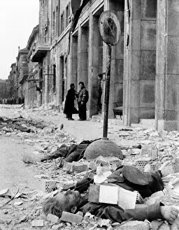 Revolts Prints: The 1956 Hungarian Uprising. A dead Russian uniformed soldier in the rubble on a Budapest street
