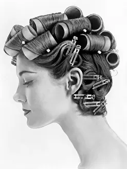 Profiles Prints: 1960s bouffant hair styles were created with big rollers on top of the head