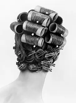 Beauty Treatments Prints: 1960s bouffant hair styles were created with big rollers on top of the head