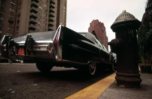 Cadillac Prints: 1970s America. A Cadillac Fleetwood parked illegally in a fire lane