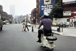 Advertisement Prints: 1970s America. A New York City police officer on a scooter