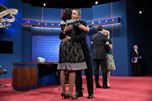 Political Campaigns Prints: 2012 Presidential nominees are embraced by their wives after the third presidential debate