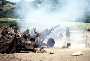 Proxy Wars Prints: 82nd Airborne soldiers fire artillery during the brief of fighting on Grenada which resulted in the death of 45