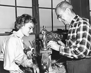 Alex Prints: Actress Dodie Heath watches craftsmen Alex Smith make an Academy Award Oscar