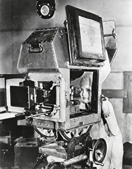 Show Business Prints: Actress Norma Shearer inspects a sound proof camera