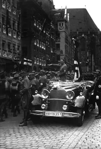 Hitler Prints: Adolf Hitler salutes parading Nazi Party storm troopers in Nuremberg