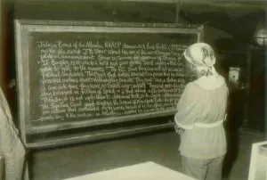 Communes Prints: An adult education student reading about Julian Bond