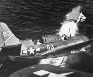 Lcgr1310 Prints: Aerial view of a Curtiss Helldiver in the landing circle above the USS YORKTOWN