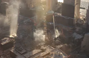 Skyscraper Prints: Aerial view of Ground Zero from the northeast as the late afternoon sun illuminates the smoke