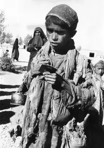 Patches Prints: Afghan youngster in a UNICEF feeding line in Chakcharan