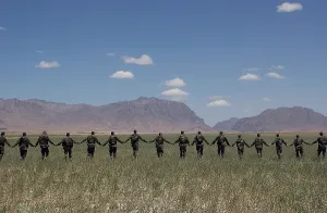 Nation Building Prints: Afghanistan National Army Soldiers form a line while participating in an unexploded ordinance field training exercise