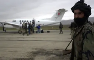 Images Dated 16th March 2011: In Afghanistan a Northern Alliance soldier provides security to the Mazir-e Sharif civilian airfield during the landing