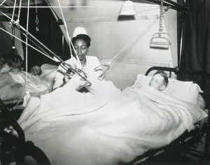 Patients Prints: African America U.S. Army Nurse treats a German POW at a prisoner-of-war hospital in England