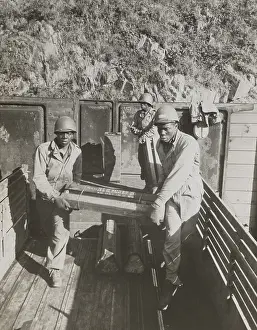 Munitions Prints: African American ammunition handlers unloading shells for the Battle of Brest in France