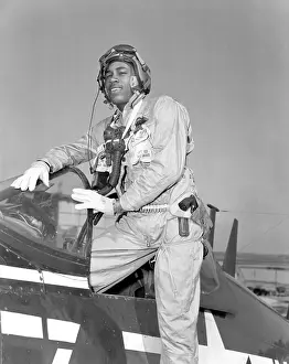 Air Force Prints: African American aviator of the 1st Marine Aircraft Wing in Korea climbs from his Corsair fighter bomber