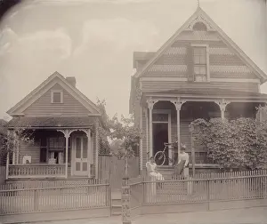 Bicycle Prints: African American boy seated on porch of house