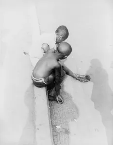 Shaved Head Prints: African American boys at Marine monument