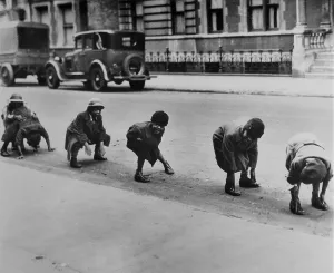 Street Scenes Prints: African American children playing leap frog in a Harlem street