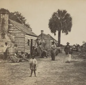 Liberation Prints: African American freedmen outside their living quarters on Fripp plantation on Saint Helena Island